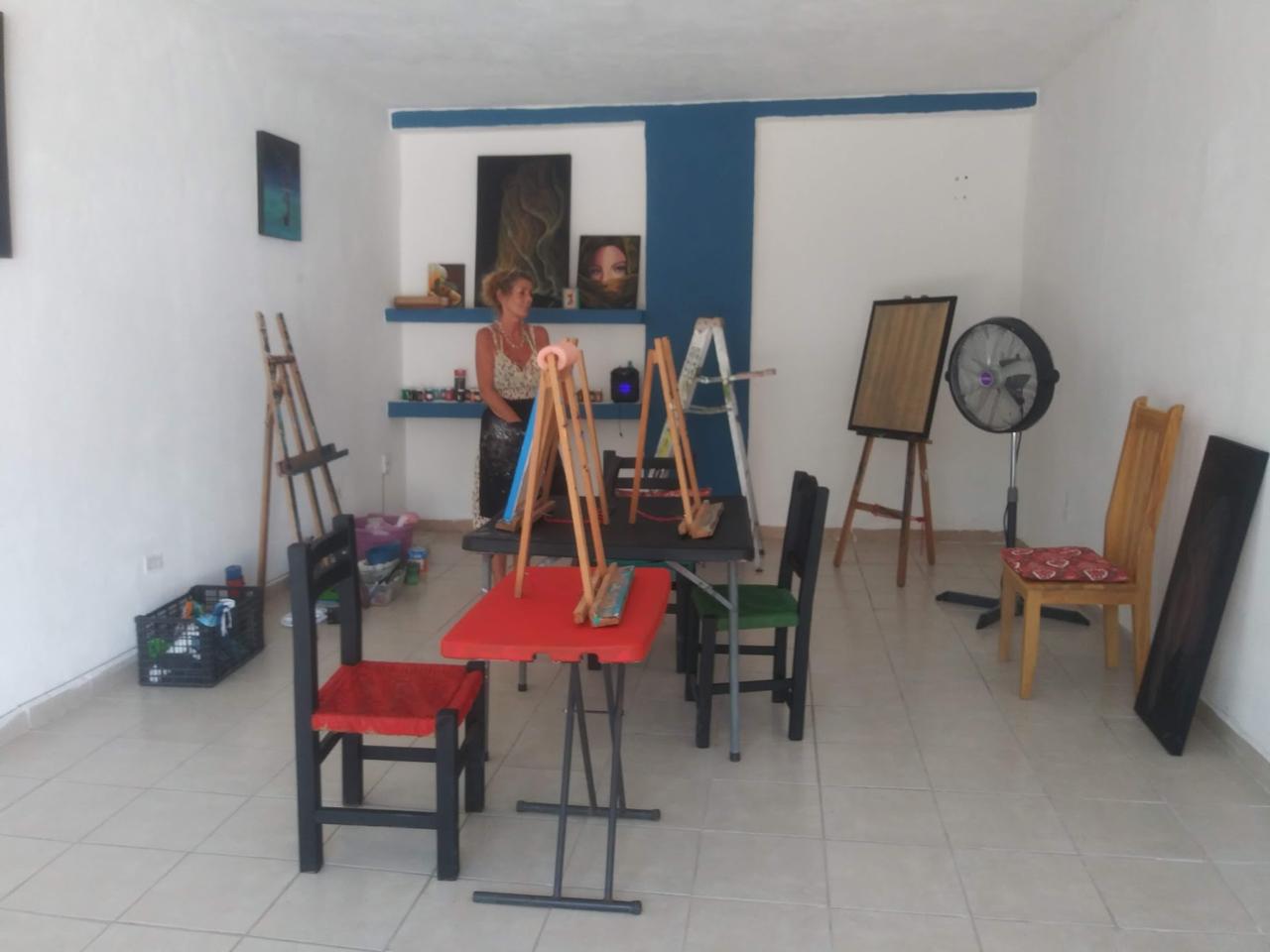 Early studio setup with easels and supplies